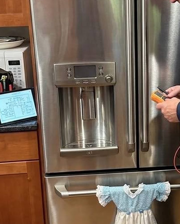 Ice and water dispenser under test on a French-door refrigerator