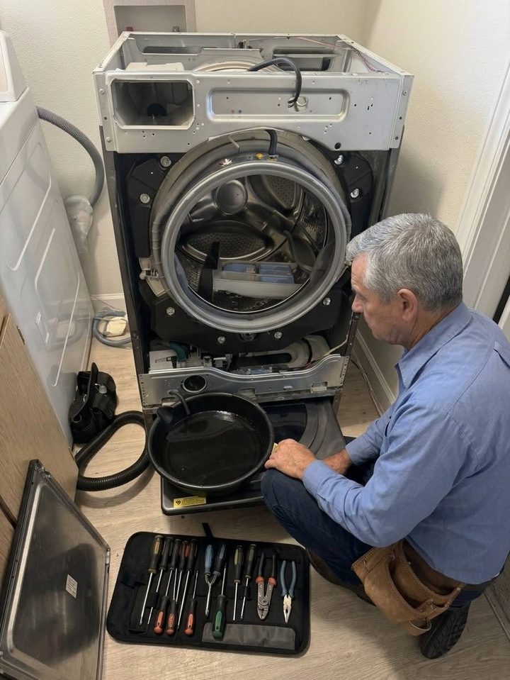 Front-loader washer open for diagnosis on a Gig Harbor house call